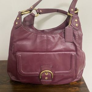 Beautiful, burgundy leather Coach hobo bag with gold hardware.